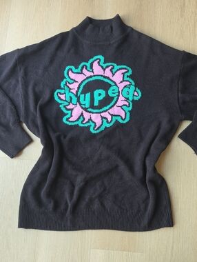Divided Black Mock-Neck Sweater with Pink & Teal Sun Motif